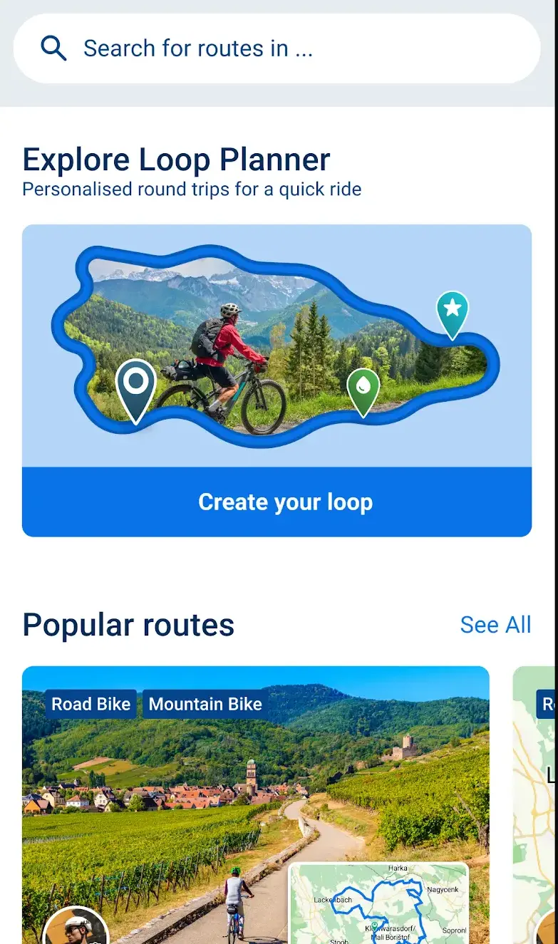 Der Routensuche-Bildschirm von Bikemap mit einem Suchfeld, einer Karte Explore Loop Planner für personalisierte Rundtouren samt Schaltfläche Create your loop und einem Karussell beliebter Community-Routen, markiert als Road Bike und Mountain Bike